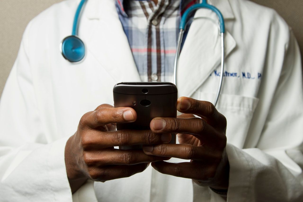 Clinician using a laptop in a modern healthcare setting